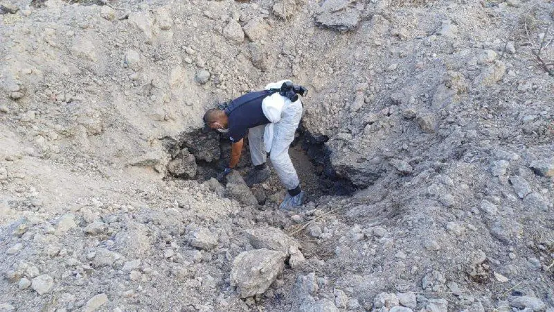 Inside the crater made from shrapnel of the Houthi missile this morning